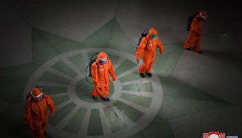 Staff disinfecting Pyongyang station in an campaign to curb the spread of COVID-19 (KCNA/EPA-EFE/Shutterstock)