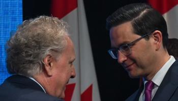 Conservative leadership candidates (L-R) Jean Charest and Pierre Poilievre at the end of their first debate in Edmonton, May 11, 2022 (Artur Widak/NurPhoto/Shutterstock)