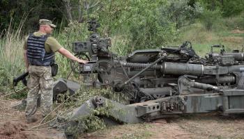 Ukrainian soldier stands beside US-supplied M777 howitzer in Ukraine's eastern Donetsk region, June 18 (Efrem Lukatsky/AP/Shutterstock)