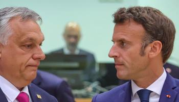 French President Emmanuel Macron (R) and Hungarian Prime Minister Viktor Orban talk before an extraordinary meeting of EU leaders to discuss Ukraine, energy and food security in Brussels, May 30 (Olivier Matthys/AP/Shutterstock)