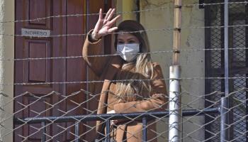 'Anez waves from within the Miraflores prison in La Paz. June 15 (Stringer/EPA-EFE/Shutterstock)