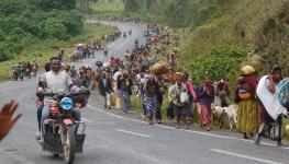 People flee renewed fighting between the Congolese army and M23 rebels, May 24, 2022 (Chine Nouvelle/SIPA/Shutterstock)