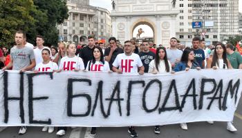 Supporters of the main nationalist opposition VMRO DPMNE party carry placard, "Ultimatum, no thank you", during a protest against the French proposal to resolve the dispute between North Macedonia and Bulgaria, outside the Parliament building, Skopje, July 10 (Georgi Licovski/EPA-EFE/Shutterstock)

