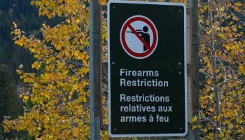 Firearms Restriction sign in Waterton, Alberta, October 5, 2021 (Artur Widak/NurPhoto/Shutterstock)