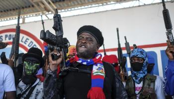 Jimmy 'Barbecue' Cherizier shouts slogans with gang members after giving a speech in Port-au-Prince, October 2021 (Matias Delacroix/AP/Shutterstock)