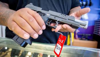 A worker at a gun store in Florida, June 22 (Cristobal Herrera-Ulashkevich/EPA-EFE/Shutterstock)