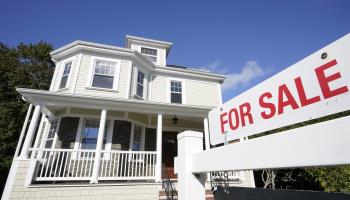 For sale sign in front of a house, United States (Steven Senne/AP/Shutterstock)