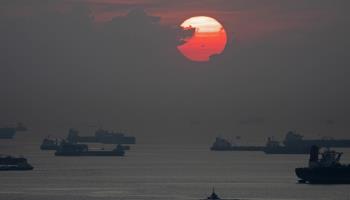 The sun rising above the Singapore Strait (Xinhua/Shutterstock)
