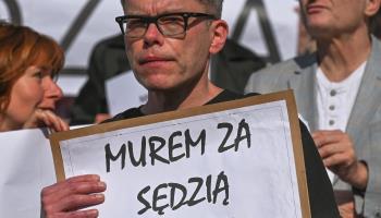 Judge Igor Tuleya holding a placard, "We Support Judge Zurek" at the protest outside the Court of Appeal in Krakow against the disciplining of Judge Waldemar Zurek, May 30, Krakow (Artur Widak/NurPhoto/Shutterstock)

