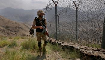 Pakistani troops patrolling along the Pakistan-Afghanistan border fence in Khyber Pakhtunkhwa province (Anjum Naveed/AP/Shutterstock)