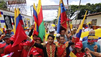 Venezuelans celebrate the inauguration of Colombian President Gustavo Petro on the Colombia-Venezuela border (Mario Caicedo/EPA-EFE/Shutterstock)