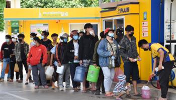 People queuing for fuel at a petrol station in Vientiane in May (Xinhua/Shutterstock)