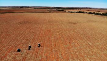 Tractors spread fertiliser on farm in South Africa's North West province (Jerome Delay/AP/Shutterstock)