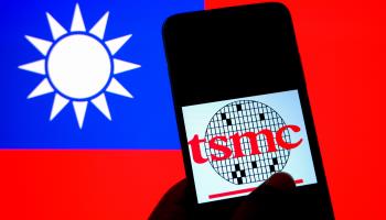 TSMC logo displayed on a smartphone with Taiwan's flag in the background (Avishek Das/SOPA Images/Shutterstock)