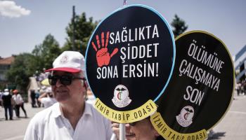 Protesters hold placards protesting against attacks on health workers at a demonstration called by the Turkish Medical Association and health professional organisations, Ankara, May 29 (Tunahan Turhan/SOPA Images/Shutterstock)


