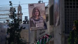 Banner featuring the slain journalist Shireen Abu Akleh, Bethlehem, West Bank, July 14 (Majdi Mohammed/AP/Shutterstock)