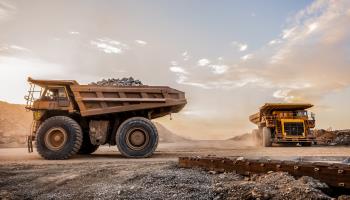 Dump trucks carrying platinum ore in Rustenburg South Africa (Shutterstock)