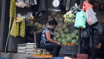 A fruit vendor works in Tegucigalpa (Gustavo Amador/EPA-EFE/Shutterstock)