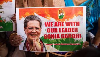 Congress workers holding a placard showing interim party President Sonia Gandhi (David Talukdar/Shutterstock)