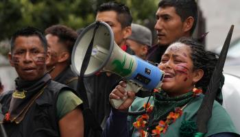 An indigenous woman speaks into a megaphone during a demonstration against the advancement of extractive industries in the jungle. Quito, September (Dolores Ochoa/AP/Shutterstock)