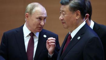 Russian President Vladimir Putin (L) with Chinese President Xi Jinping in a group with Shanghai Cooperation Organisation leaders in Samarkand, September 16 (Sergey Bobylev/Sputnik/Kremlin pool/EPA-EFE/Shutterstock)