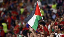 Moroccan supporters at FIFA World Cup wave the Palestinian flag, Qatar, December 14, 2022 (Hollandse Hoogte/Shutterstock)