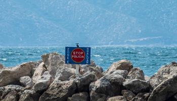 Prohibited area sign at mooring for Albanian and Italian police boats patrolling for criminals and drug dealers, Vlore, Albania,  April 2019 (Aldo91/Shutterstock).