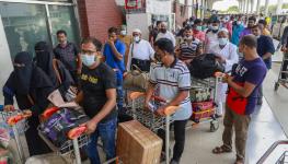 Bangladeshi migrants queue for flight to Saudi Arabia, Hazrat Shahjalal International Airport, Bangladesh (Suvra Kanti Das/ABACA/Shutterstock)