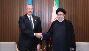 Iranian President Ebrahim Raisi (R) meets Azerbaijan's Ilham Aliyev on neutral ground in Kazakhstan, October 13 (Parspix/ABACA/Shutterstock)