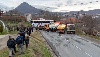 Serbs remove a truck-made barricade near Rudare, Mitrovica, December  29 (Vudi Xhymshiti/VX/Shutterstock)