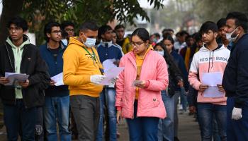 Students outside an examination centre before appearing for a key university admissions test (Sanchit Khanna/Hindustan Times/Shutterstock)