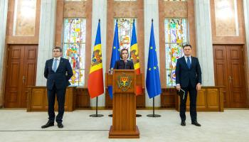 Moldovan President Maia Sandu (centre) with her nominated prime minister, Dorin Recean (R) and parliamentary speaker Igor Grosu, February 10 (Dumitru Doru/EPA-EFE/Shutterstock) 