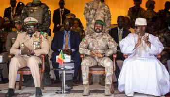 Malian junta leader Colonel Assimi Goita (centre) at an independence day military parade. Guinean junta leader Colonel Mamadi Doumbouya (left) is also present (Uncredited/AP/Shutterstock)