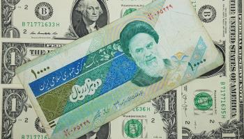 Iranian rial and the US dollar (Shutterstock)