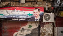 Banner featuring Syrian President Bashar al-Assad, Damascus, May 2022 (Shutterstock)