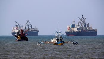 Chinese vessels anchored near Philippine fishing boats in the South China Sea (Francis R Malasig/EPA-EFE/Shutterstock)