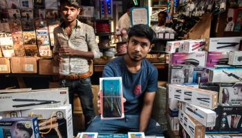 An Indian shopkeeper selling Chinese electronics in a market in Kolkata, West Bengal (Shutterstock)