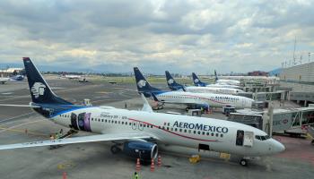 Aeromexico aircraft lined up at gates at Mexico City International Airport, 2018 (Shutterstock)