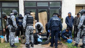 Bosnian police and migrants arrested at the border with EU member Croatia (Shutterstock)