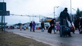 Ukrainian refugees entering Poland from Ukraine fleeing the intensifying war, Medyka, Poland, March 4, 2022 (Davide Bonaldo/Shutterstock)