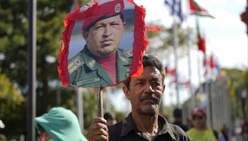 A supporter queues to visit Chavez's tomb on the anniversary of his death (Ariana Cubillos/AP/Shutterstock)