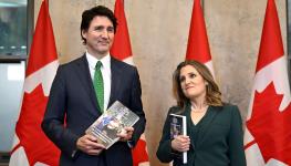 Prime Minister Justin Trudeau and Finance Minister Chrystia Freeland holding copies of this year's budget, unveiled by Freeland on March 28 in Ottawa (Canadian Press/Shutterstock)