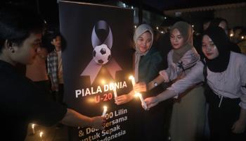 A vigil in Jakarta following FIFA's decision to remove Indonesia as the host of the 2023 Under-20 World Cup (Bagus Indahono/EPA-EFE/Shutterstock)