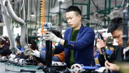 Assembly line workers in China (Shutterstock)