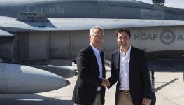 Prime Minister Justin Trudeau (r) and NATO Secretary General Jens Stoltenberg shake hands at Cold Lake, Canada's largest fighter base, Alberta, August 26, 2022 (Canadian Press/Shutterstock)