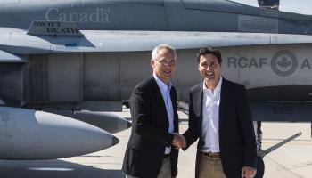 Prime Minister Justin Trudeau (r) and NATO Secretary General Jens Stoltenberg shake hands at Cold Lake, Canada's largest fighter base, Alberta, August 26, 2022 (Canadian Press/Shutterstock)