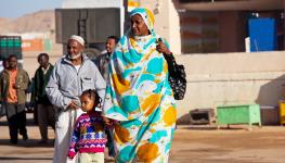 Sudanese meeting a ferry from Egypt in border town, Wadi Halfa, 2010 (Shutterstock)