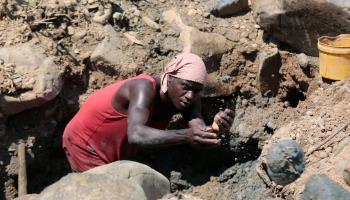 An artisanal miner pans for gold in Mutare, Zimbabwe, November 7, 2020 (Aaron Ufumeli/EPA-EFE/Shutterstock)