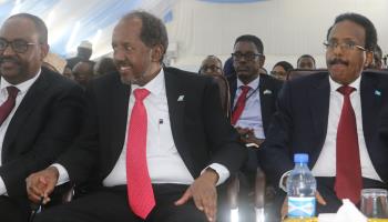 President Hassan Sheikh Mohamud sits between former President Mohammed Abdullahi 'Farmajo' and Puntland President Said Abdullahi Deni after being elected as president, May 16, 2022. (SAID YUSUF WARSAME/EPA-EFE/Shutterstock)