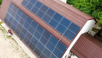 Solar panels on a rooftop (Dominika Zarzycka/SOPA Images/Shutterstock)